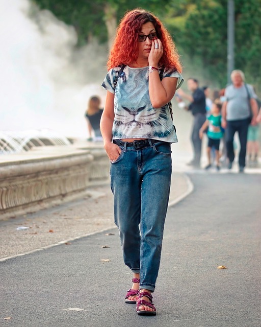 Women’s streetwear outfit styled with cropped jacket, wide leg pants, and chunky sneakers.