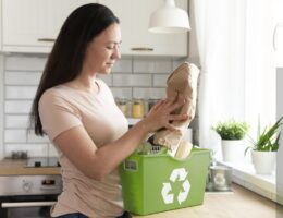 Person organising reusable items for a zero waste lifestyle at home