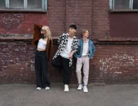 Model wearing modern streetwear outfit with oversized hoodie, cargo pants, and sneakers